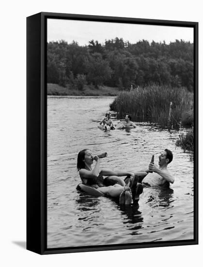 Couple Drinking Beer at Inner Tube Floating Party on the Apple River-Alfred Eisenstaedt-Framed Stretched Canvas
