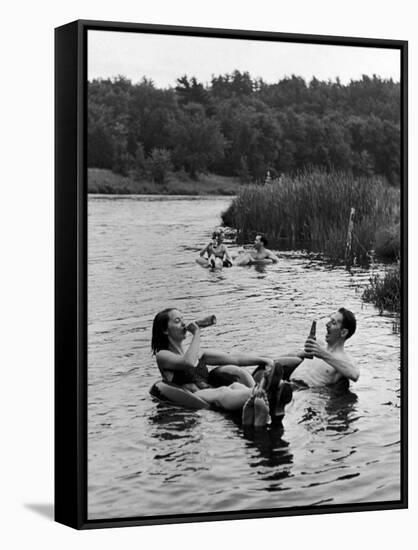 Couple Drinking Beer at Inner Tube Floating Party on the Apple River-Alfred Eisenstaedt-Framed Stretched Canvas