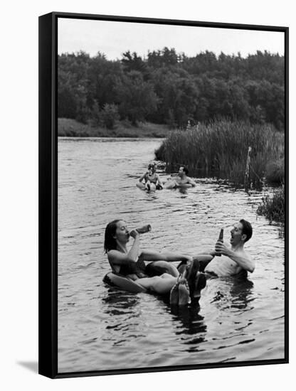 Couple Drinking Beer at Inner Tube Floating Party on the Apple River-Alfred Eisenstaedt-Framed Stretched Canvas