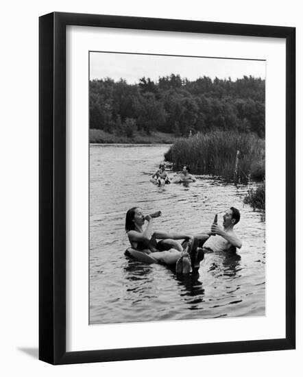 Couple Drinking Beer at Inner Tube Floating Party on the Apple River-Alfred Eisenstaedt-Framed Photographic Print