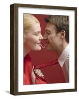 Couple Eating a Strand of Spaghetti from Both Ends-null-Framed Photographic Print