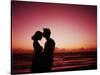 Couple Enjoying a Romantic Sunset on the Beach-Bill Bachmann-Stretched Canvas