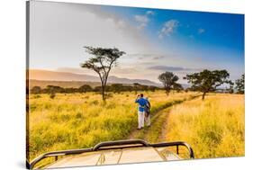 Couple enjoying view at a safari camp, Zululand, South Africa-Laura Grier-Stretched Canvas