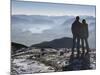 Couple Gazing at Mountain Landscape-Anthony West-Mounted Photographic Print