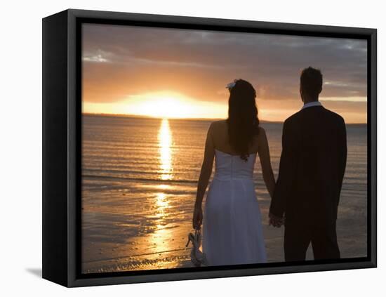 Couple Hand in Hand Watch Sun Set from Beach, Kingfisher Bay, Fraser Island, Queensland, Australia-Andrew Watson-Framed Stretched Canvas