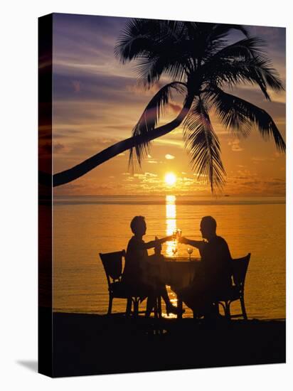 Couple Having Dinner at the Beach, Toasting Glasses, Maldives, Indian Ocean, Asia-Sakis Papadopoulos-Stretched Canvas