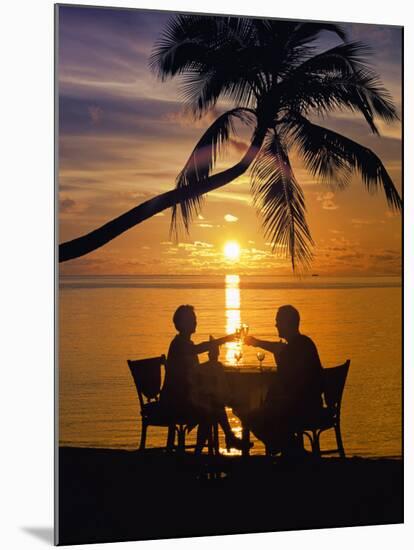 Couple Having Dinner at the Beach, Toasting Glasses, Maldives, Indian Ocean, Asia-Sakis Papadopoulos-Mounted Photographic Print