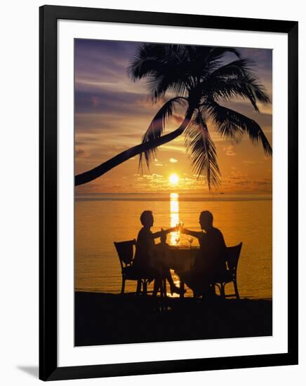 Couple Having Dinner at the Beach, Toasting Glasses, Maldives, Indian Ocean, Asia-Sakis Papadopoulos-Framed Photographic Print