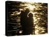 Couple Hug Each Other in the Winter Sunshine by the River Danube in Budapest, Hungary-null-Stretched Canvas