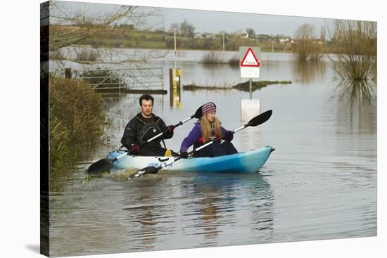 Couple in Kayak During January 2014 Flooding-David Woodfall-Stretched Canvas