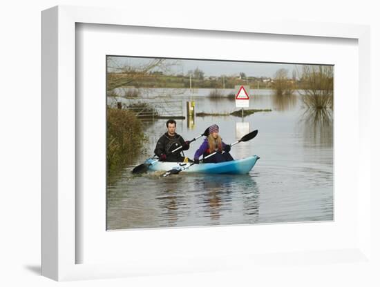 Couple in Kayak During January 2014 Flooding-David Woodfall-Framed Photographic Print