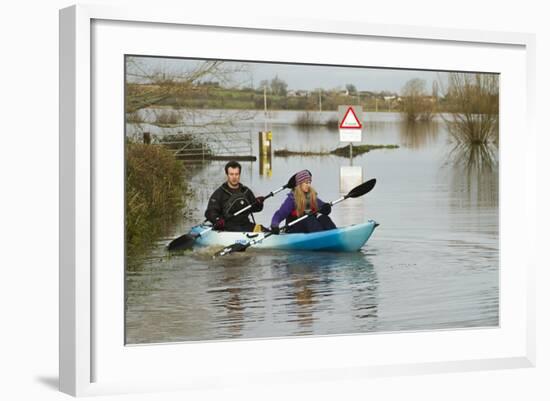 Couple in Kayak During January 2014 Flooding-David Woodfall-Framed Photographic Print