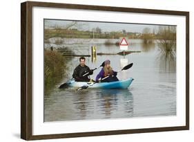 Couple in Kayak During January 2014 Flooding-David Woodfall-Framed Photographic Print