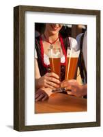 Couple in Traditional Bavarian Tracht - Dirndl and Lederhosen - in a Beer Tent at the Oktoberfest O-Kzenon-Framed Photographic Print