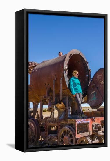 Couple of Tourists Visiting Cementerio De Trenes (Train Cemetery), Salar De Uyuni, Bolivia-Elzbieta Sekowska-Framed Stretched Canvas