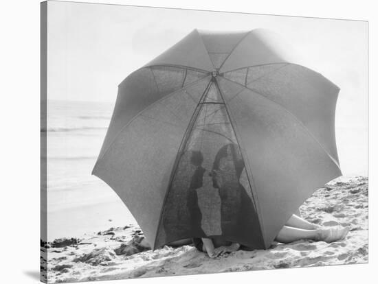 Couple on Beach under Umbrella-null-Stretched Canvas