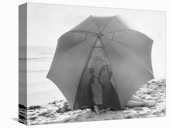 Couple on Beach under Umbrella-null-Stretched Canvas