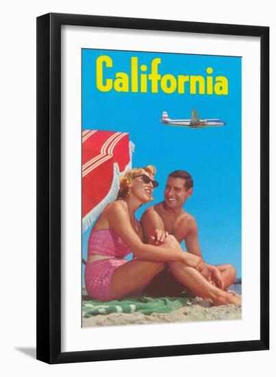 Couple on Beach with Airplane in Sky-null-Framed Art Print