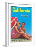 Couple on Beach with Airplane in Sky-null-Framed Art Print