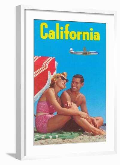 Couple on Beach with Airplane in Sky-null-Framed Art Print