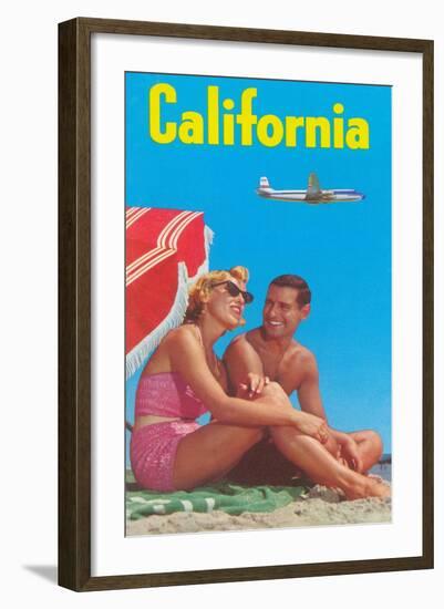 Couple on Beach with Airplane in Sky-null-Framed Art Print