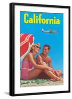 Couple on Beach with Airplane in Sky-null-Framed Art Print