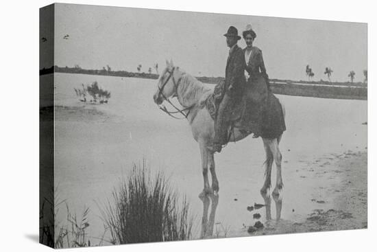 Couple on Horseback in Traditional Costume of Arles-null-Stretched Canvas