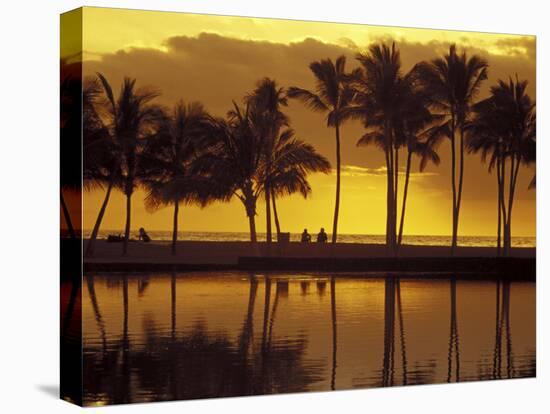 Couple, Palm Trees and Sunset Reflecting in Lagoon at Anaeho'omalu Bay, Big Island, Hawaii, USA-Merrill Images-Stretched Canvas