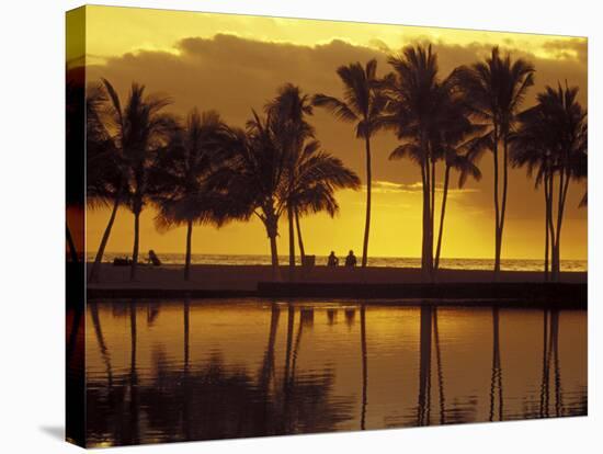 Couple, Palm Trees and Sunset Reflecting in Lagoon at Anaeho'omalu Bay, Big Island, Hawaii, USA-Merrill Images-Stretched Canvas