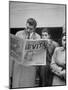 Couple Reading Newspaper Account of the Death of Evita Peron at 33 from Cancer-Alfred Eisenstaedt-Mounted Photographic Print