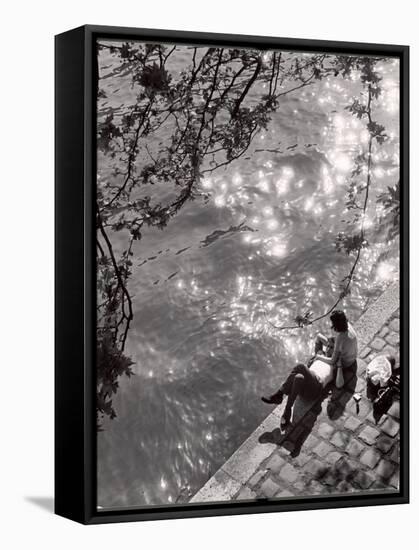 Couple Relaxing on Bank of Seine Near Notre Dame Cathedral During Lunch Hour-Alfred Eisenstaedt-Framed Stretched Canvas