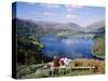 Couple Resting on Bench, Viewing the Lake at Grasmere, Lake District, Cumbria, England, UK-Nigel Francis-Stretched Canvas