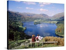 Couple Resting on Bench, Viewing the Lake at Grasmere, Lake District, Cumbria, England, UK-Nigel Francis-Stretched Canvas