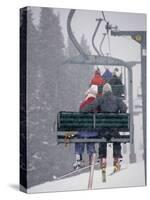 Couple Riding Up the Ski Lift During a Snow Storm, Vail, Colorado, USA-Paul Sutton-Stretched Canvas