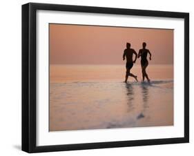 Couple Running on Beach, Felidu Atoll, Maldives-Stuart Westmorland-Framed Photographic Print