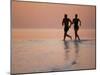 Couple Running on Beach, Felidu Atoll, Maldives-Stuart Westmorland-Mounted Photographic Print