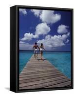 Couple Running on Dock, Curacao, Caribbean-Greg Johnston-Framed Stretched Canvas