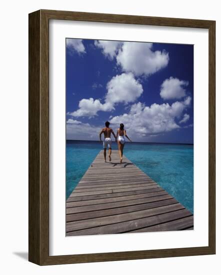 Couple Running on Dock, Curacao, Caribbean-Greg Johnston-Framed Photographic Print