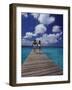 Couple Running on Dock, Curacao, Caribbean-Greg Johnston-Framed Photographic Print