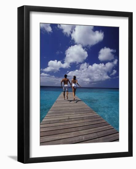 Couple Running on Dock, Curacao, Caribbean-Greg Johnston-Framed Photographic Print