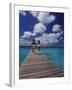 Couple Running on Dock, Curacao, Caribbean-Greg Johnston-Framed Photographic Print