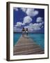 Couple Running on Dock, Curacao, Caribbean-Greg Johnston-Framed Photographic Print