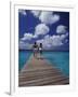 Couple Running on Dock, Curacao, Caribbean-Greg Johnston-Framed Photographic Print