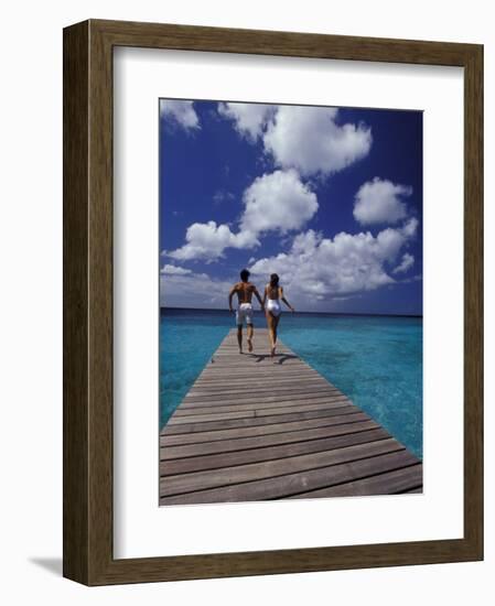 Couple Running on Dock, Curacao, Caribbean-Greg Johnston-Framed Photographic Print