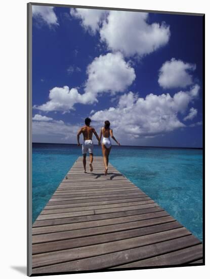 Couple Running on Dock, Curacao, Caribbean-Greg Johnston-Mounted Photographic Print