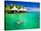 Couple Snorkling in Tropical Lagoon with over Water Bungalows-Martin Valigursky-Stretched Canvas