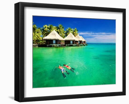 Couple Snorkling in Tropical Lagoon with over Water Bungalows-Martin Valigursky-Framed Photographic Print