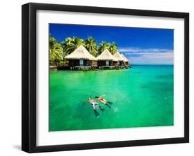 Couple Snorkling in Tropical Lagoon with over Water Bungalows-Martin Valigursky-Framed Photographic Print