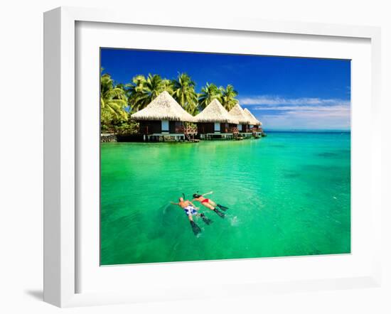 Couple Snorkling in Tropical Lagoon with over Water Bungalows-Martin Valigursky-Framed Photographic Print