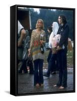 Couple Standing Barefoot on a Road Holding a Bundle and Wine Bottle, Woodstock Music and Art Fair-John Dominis-Framed Stretched Canvas